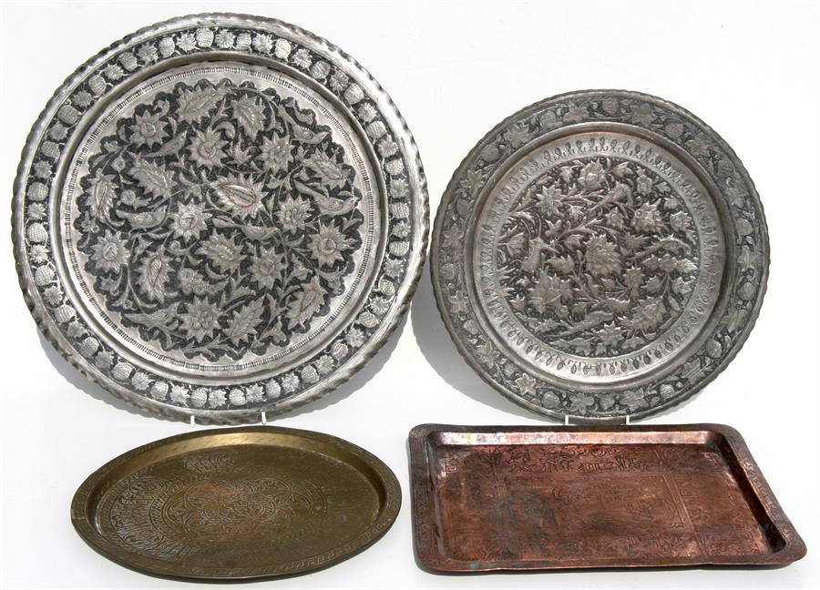 A group of four Islamic / Egyptian trays or chargers, the largest 50cms (19.75ins) diameter.