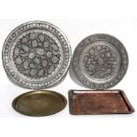 A group of four Islamic / Egyptian trays or chargers, the largest 50cms (19.75ins) diameter.