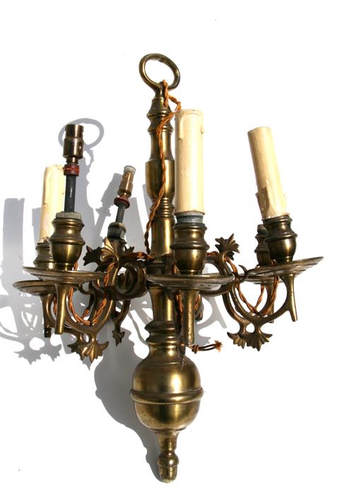 A seven-arm continental style brass ceiling light.