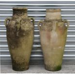 Two well weathered four-handled terracotta urns, 82cms (32.25ins) high.