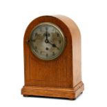 An oak cased brewery mantle clock with fusee movement, the silvered dial with Arabic numerals, 35.