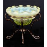 A yellow Vaseline glass bonbon dish on a silver plated stand, 13cms (5ins) diameter.