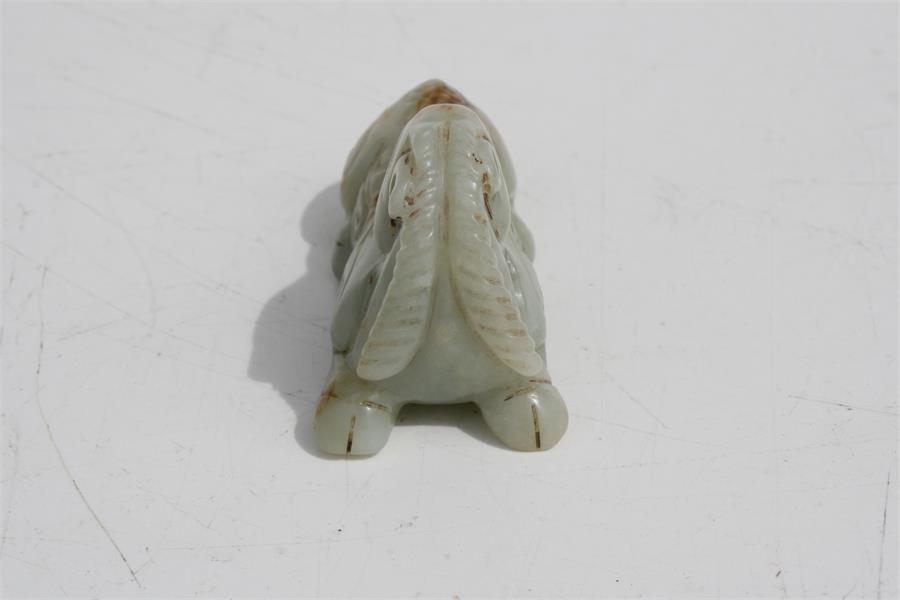 A Chinese mutton jade figure in the form of a recumbent horse, 7.5cms (3ins) long. Condition - Image 4 of 8