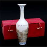 A Chinese porcelain vase decorated with figures in a mountainous landscape, 25.5cms (10ins) high.