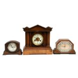 A Victorian walnut cased mantle clock, the enamelled dial with Arabic numerals; together with two