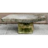 A well weather Purbeck stone garden table. 156cm (61.5 ins) wide