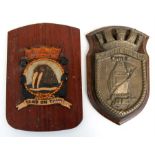 A hand painted aluminium ships crest or plaque mounted on a wooden shield to the Royal Netherlands