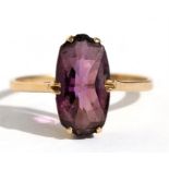 A 9ct gold ring set with a single large oval amethyst, approx UK size 'P'.