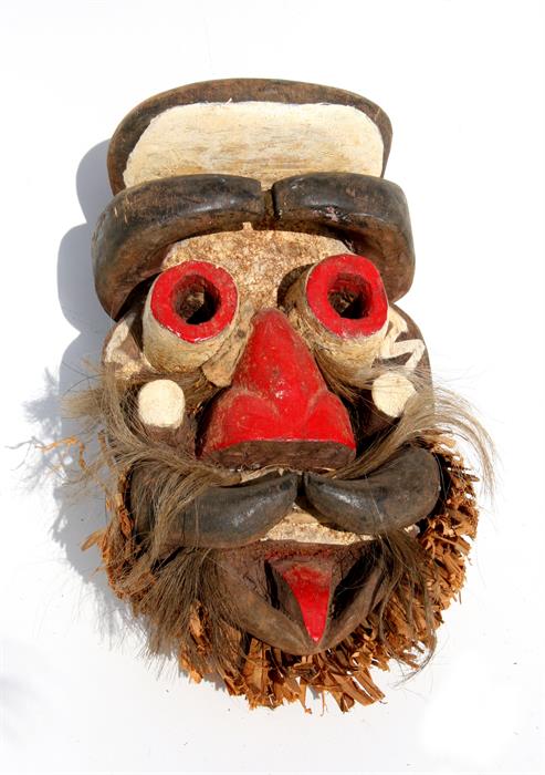Tribal / African Art - an African carved and painted wooden mask, 33cms (13ins) high.