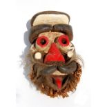 Tribal / African Art - an African carved and painted wooden mask, 33cms (13ins) high.