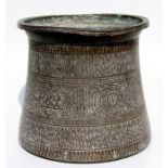 A large Eastern brass palm pot with Islamic script roundels and other engraved decoration, 31cms (