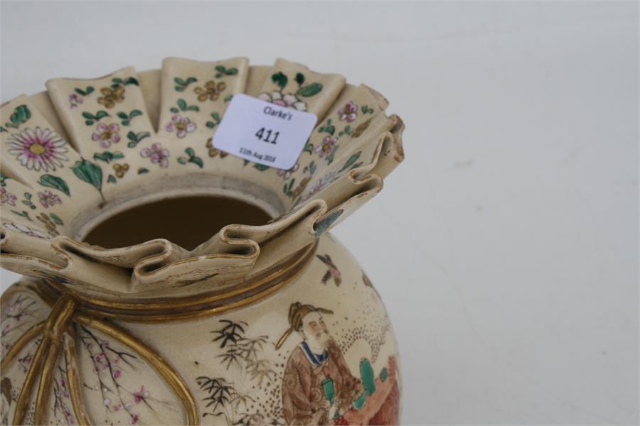 A late 19th century Japanese Satsuma vase in the form of a tied bag, decorated with figures in a - Image 3 of 4