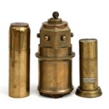Three WWI trench art table petrol lighters of different forms, the tallest 14.5cms (5.75ins).