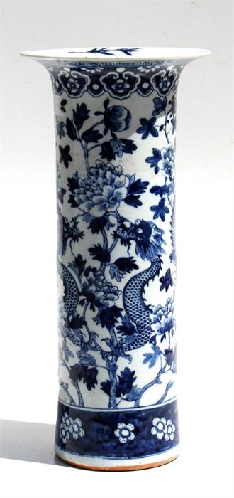 A 19th century Chinese blue & white sleeve vase decorated with a dragon amongst foliage (