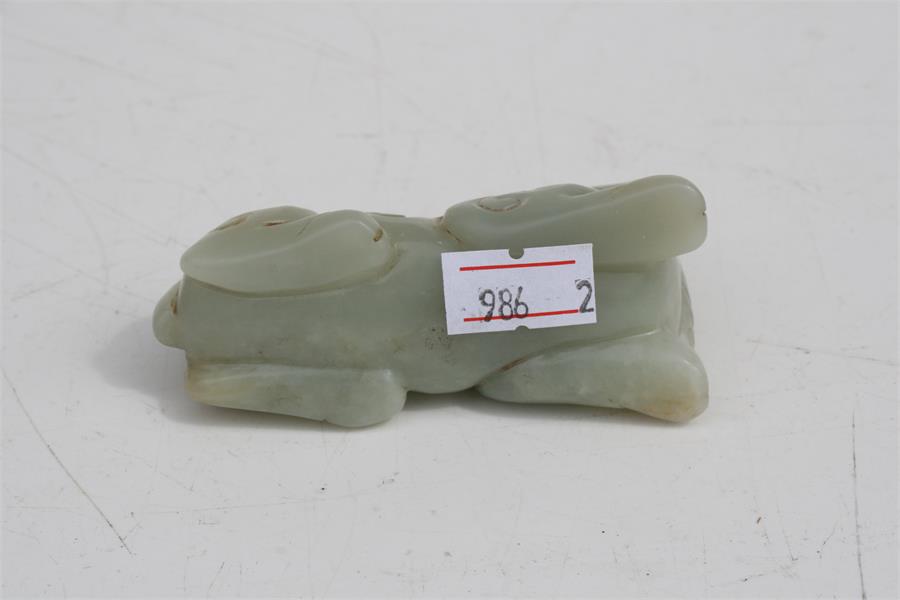 A Chinese mutton jade figure in the form of a recumbent horse, 7.5cms (3ins) long. Condition - Image 7 of 8