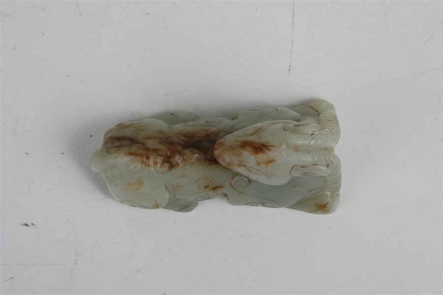 A Chinese mutton jade figure in the form of a recumbent horse, 7.5cms (3ins) long. Condition - Image 2 of 8