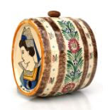 A Quimper sherry barrel decorated with a young woman and flowers 14.5cms (5.7ins) high. Condition