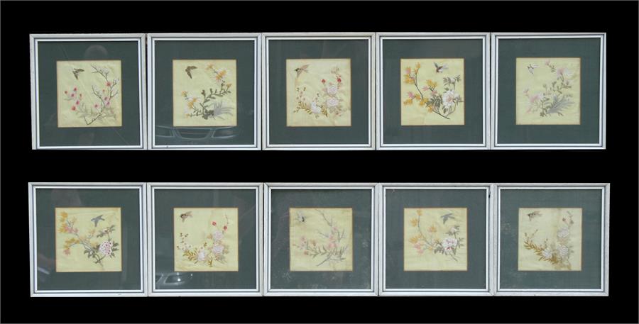 A group of ten Chinese silk embroidered panels, each decorated with birds, insects and flowers,