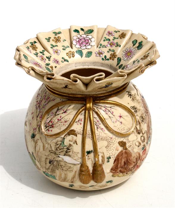 A late 19th century Japanese Satsuma vase in the form of a tied bag, decorated with figures in a