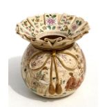 A late 19th century Japanese Satsuma vase in the form of a tied bag, decorated with figures in a