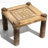Tribal / African - an African hardwood stool on turned legs with leather seat.