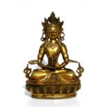 A large gilt bronze figure of a seated Buddha, 28.5cms (11.2ins) high.