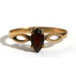 A 9ct gold ring set with a central garnet, approx UK size 'N'.