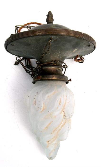 An early 20th century brass ceiling light with frosted glass flame shaped shade.