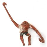 A Japanese carved wooden and gesso figure of a hanging monkey, 58.5cms (233ins) high.