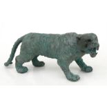 A Chinese style bronze model of a tiger, 30cms (11.75ins) long.