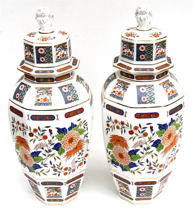 A large pair of 20th century Chinese style vases & covers, decorated with flowers and fo dog