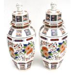 A large pair of 20th century Chinese style vases & covers, decorated with flowers and fo dog