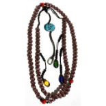 A Chinese Buddhist mala bead necklace with 108 cats eye agate beads.