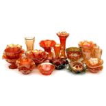 A large quantity of late 19th / early 20th century Carnival glass items including vases, pedestal