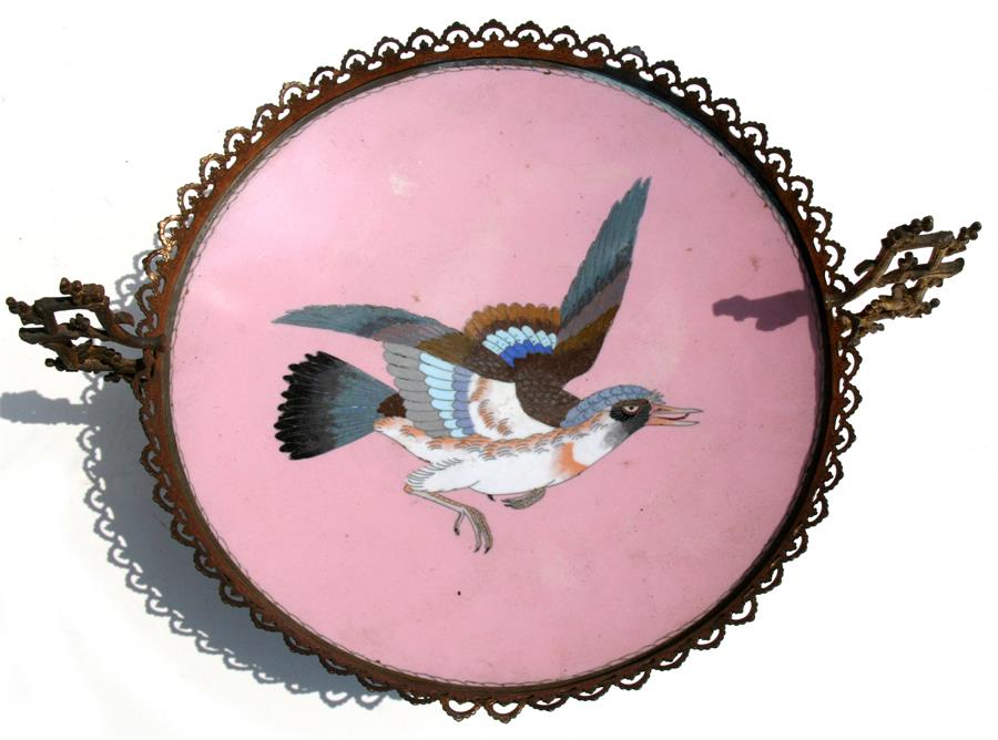 A late 19th century Japanese cloisonne plate decorated with a central bird on a pink ground, later