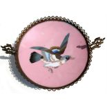 A late 19th century Japanese cloisonne plate decorated with a central bird on a pink ground, later