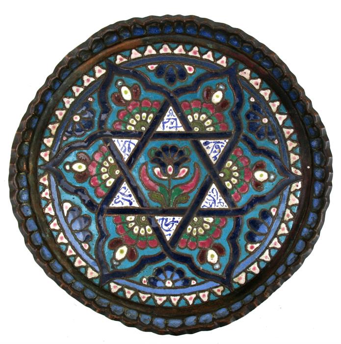 A Syrian enamelled copper tray decorated with a central flower within a star and calligraphy. 31cm