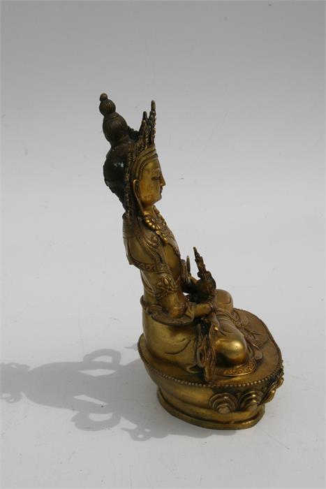 A large gilt bronze figure of a seated Buddha, 28.5cms (11.2ins) high. - Image 3 of 6