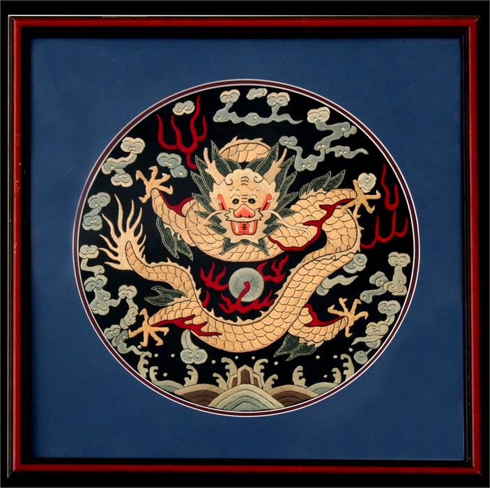 A Chinese circular silk embroidered panel depicting a dragon chasing a flaming pearl, framed & - Image 4 of 7