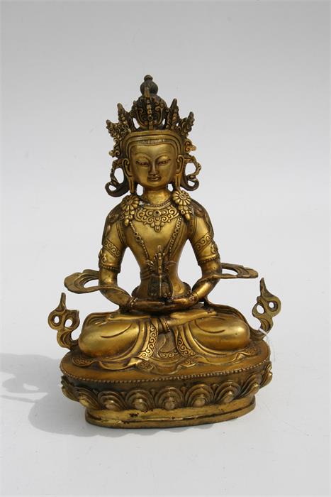 A large gilt bronze figure of a seated Buddha, 28.5cms (11.2ins) high. - Image 2 of 6