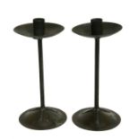 A pair of Arts & Crafts copper candle stands, 27cms (10.5ins) high. Condition Report One candle