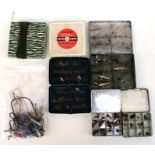 Three tins of vintage fly fishing flies together with a quantity of fishing lures including Devon