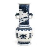 A Chinese blue and white vase decorated a landscaped and fruit, having a Kangxi seal mark to the