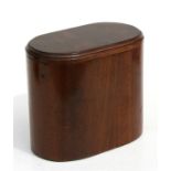 A mahogany and figured walnut oval tea caddy, 16cms (6.25ins) wide.