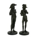 A pair of late 19th century French spelter novelty figural caricature candlesticks. 32cm (12.5ins)