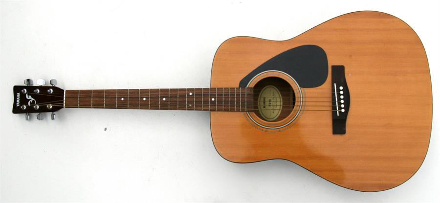 A Yamaha F310 acoustic guitar.