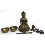 A gilded bronze Buddha seated in meditation, 31cms (12.75ins) high; together with a group of