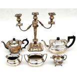 A silver plated three-arm candelabrum; together with two silver plated part tea-sets.