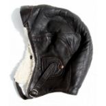 A vintage fur lined leather flying helmet.