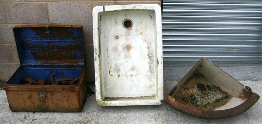 A cast iron corner feeder or planter, 86cms (34ins) wide; a large Belfast sink, 92cms (36ins)